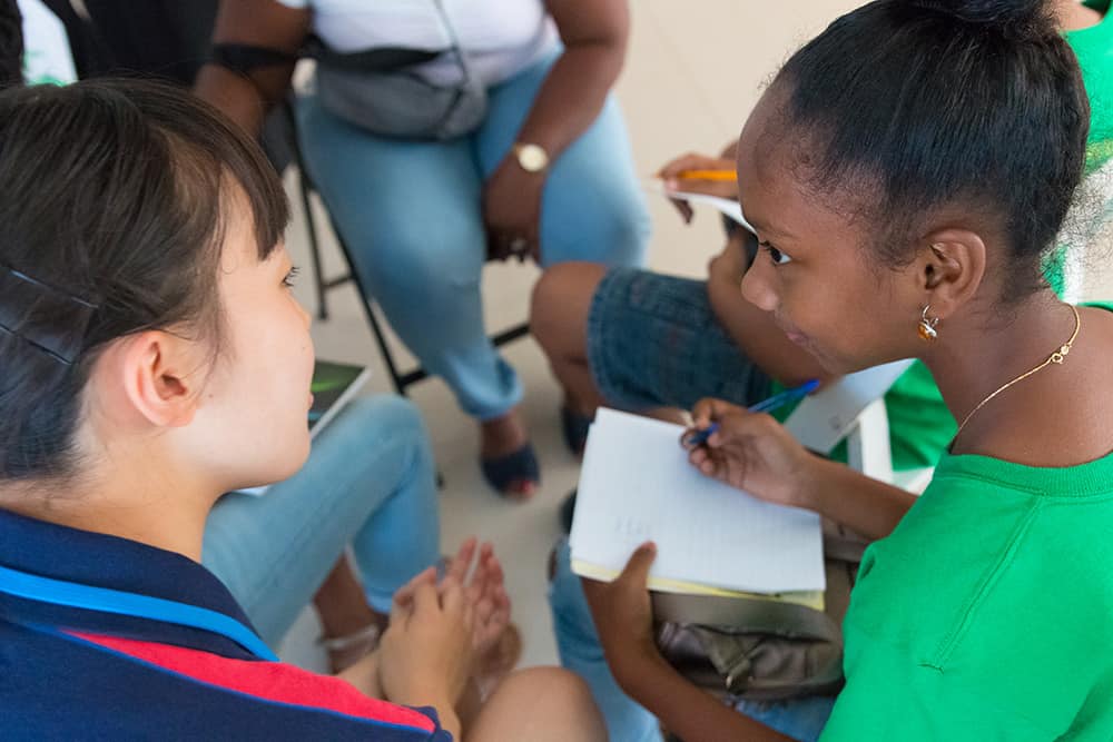 Two Students Exchange Notes