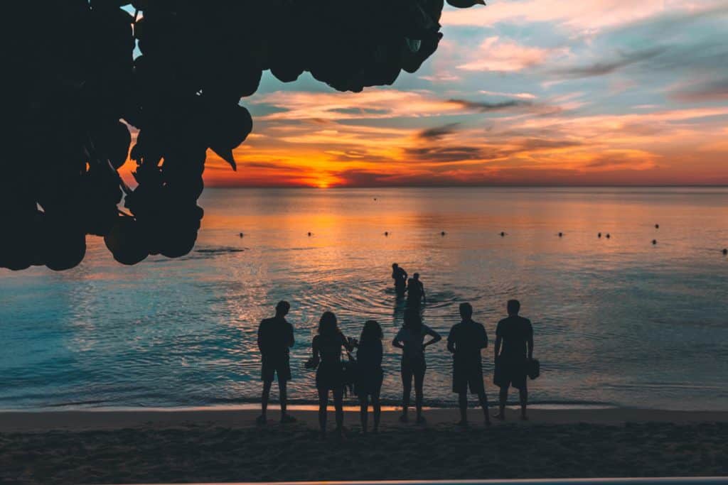 Group of people watching sunset