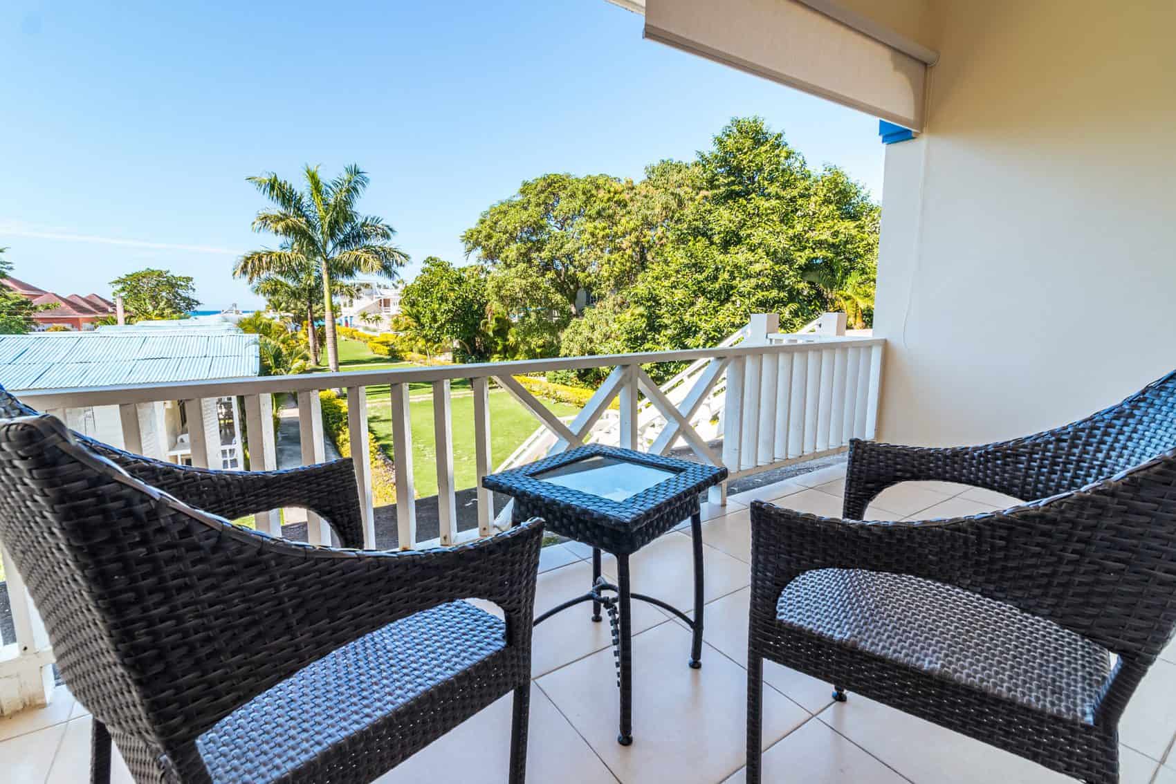 Two chairs and coffee table on balcony